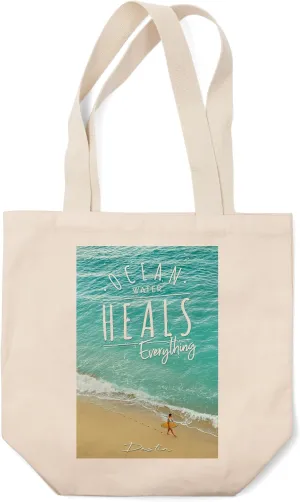 Lantern Press Destin, Florida, Surfer Walking on Beach, Ocean Water Heals Everything (100% Cotton Canvas Reusable Tote Bag)
