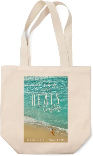 Ocean City, Maryland, Surfer Walking on Beach, Ocean Water Heals Everything Press (100% Cotton Canvas Reusable Tote Bag)